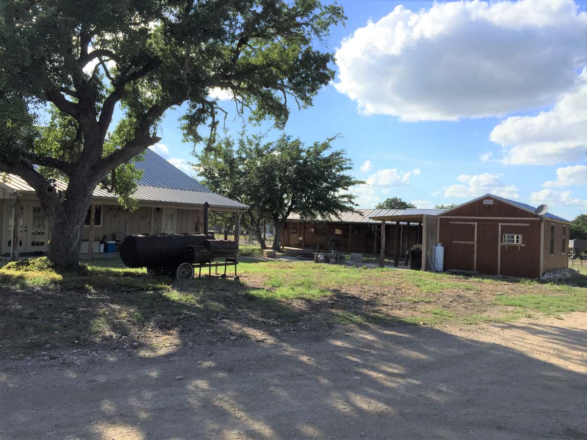 Cabins and shaded grounds at the FF Hunting Ranch camp