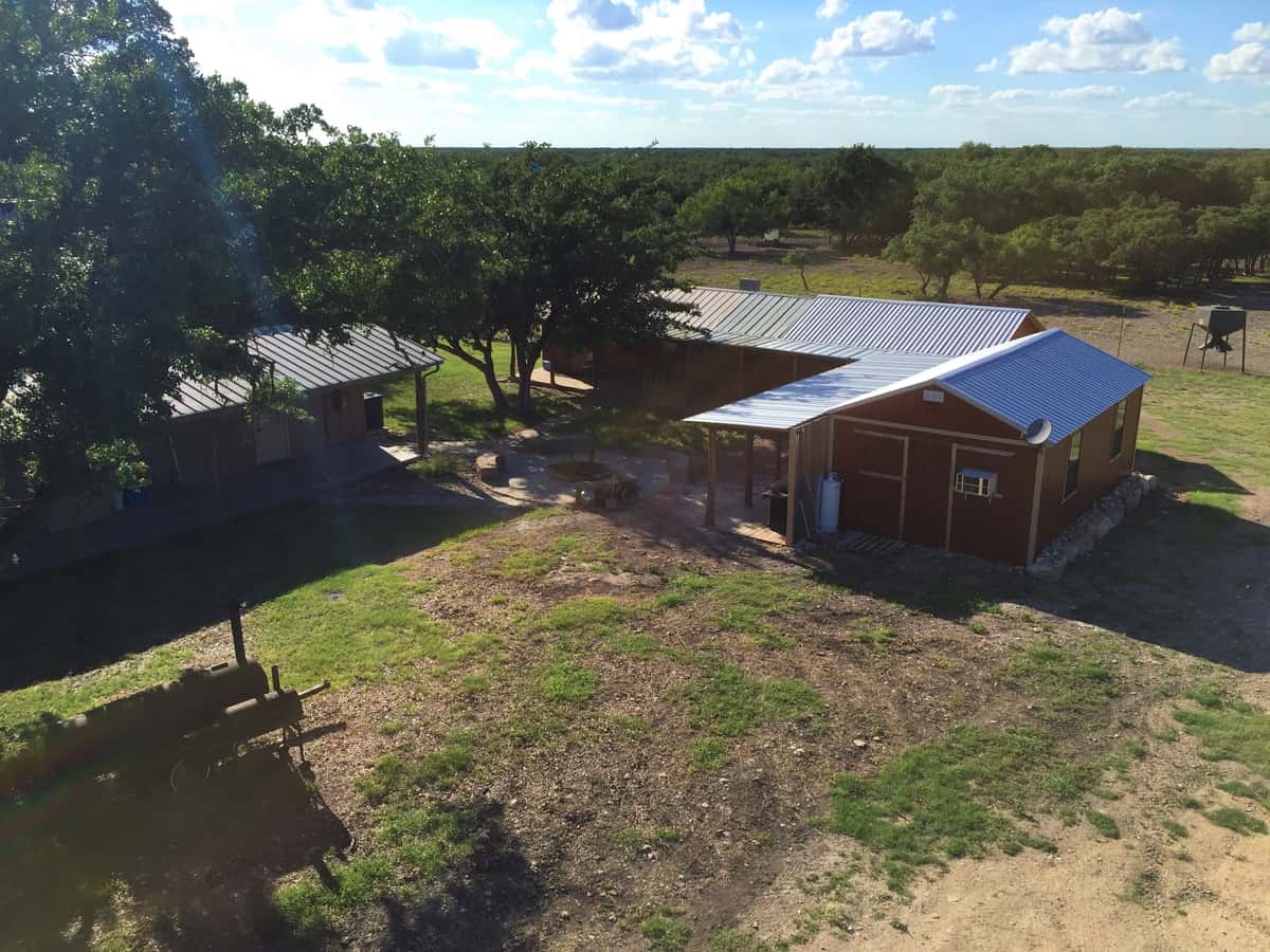 Aerial view of the cabins and gathering area at FF Hunting Ranch